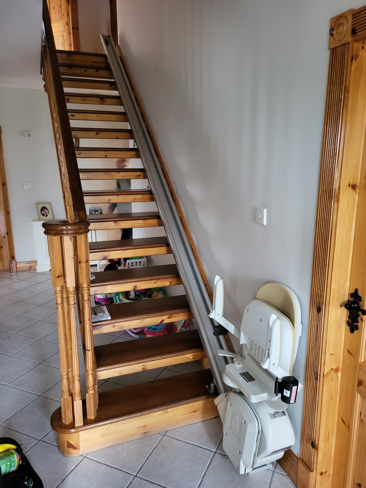 Straight stairlift on wooden staircase
