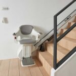 Dublin Straight Stairlift on a Wooden Staircase With Black Handrail